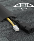 6ft Floor Cord Cover Cable Protector for Home and Office hiding two cables on carpet, black flexible PVC, 0.63" wide by 0.31" high.