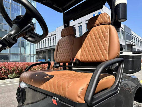 Pro Grade Two Passenger Electric Golf Cart Featuring Fast Charge Lithium Battery And Slick Aluminum Frame seating interior with quilted brown cushions.