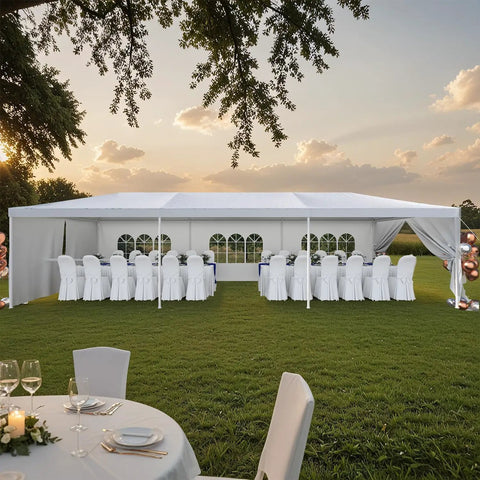 Built Tough 10 By 30 Foot Heavy Duty Outdoor Wedding Canopy With Eight Sidewalls Offering Full Uv Protection And Being Totally Waterproof Perfect For Your Backyard Parties And Big Events set up in a garden with dining tables and chairs