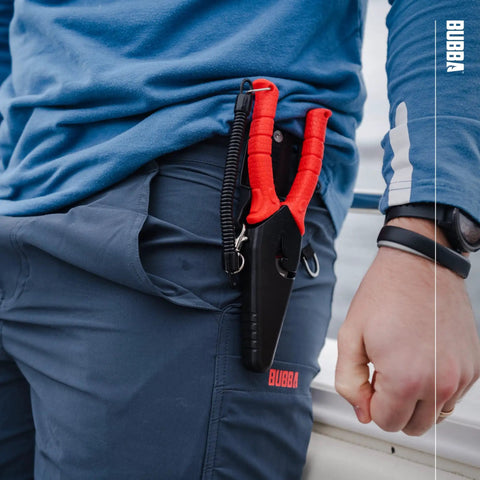 8.5 Inch Stainless Steel Pliers With Non Slip Handle, Spring Loaded, in sheath attached to person's side