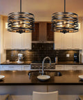 Modern kitchen with two industrial pendant lights over island, showcasing a 12.6 Inch Farmhouse Chandelier For Dining Room With Three Light Industrial Metal Hanging Light Fixture Rustic Drum Pendant Black Dope Retro Wood Texture Interior Decor For Kitchen Foyer Entryway And Bedroom