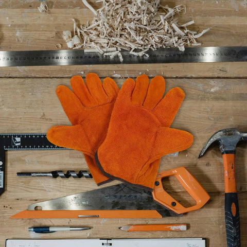 Full Leather Short Welding Gloves For Men on wooden workbench with tools, heat resistant, abrasion resistant, orange leather gloves