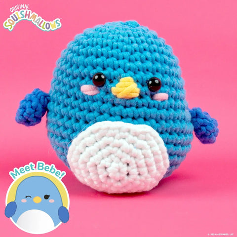 Blue plush toy penguin with white belly and yellow beak. "Meet Bebe!" text and cartoon penguin in bottom left corner.