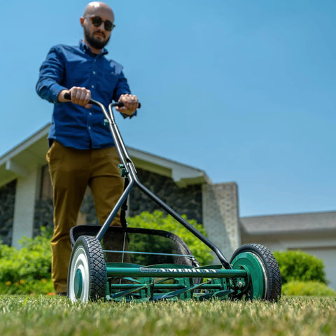 16 Inch 7 Blade Reel Lawn Mower With Grass Catcher For Bermuda Zoysia And Tiff Short Grass Types Eco Friendly Push Mower For Precise Neat Yard Care And Clean Cuts, green manual mower in use
