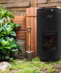 34 Gallon Outdoor Compost Bin With Handles And Observation Windows, Thickened Breathable Foldable Design in garden setting