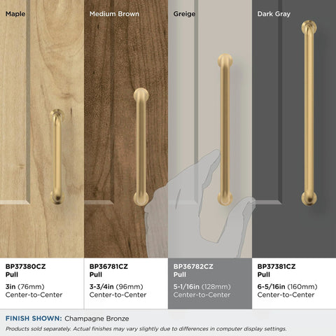 Four Champagne Bronze cabinet pulls on different wood finishes showing various sizes, including 5-1/16 in center-to-center mounting.