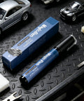 Scratch Repair Pen For Cars And More, Waterproof 5ml Quick Fix beside packaging on workshop bench with model cars