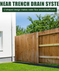 HDPE Channel Drain With Grates Two Pack 19.7x5.5x3.7 Inch Trench Drain System next to a wooden fence and house in a garden setting.