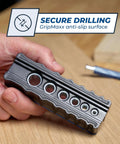 Kreg portable drilling guide with six hardened drill guides; gray metal, held in hand