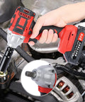 Ehozirta Cordless Impact Wrench 1/2 Inch held by hand above an engine, showcasing brushless motor and battery for tough jobs.