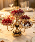 Smooth Spin Five Plate Amber Glass Serving Stand With Four Swivel Bowls And One Center Platter Gold Plated Bracket Black Crystal Details Quick Party Prep Head Turning Dessert Tray Decor filled with fruits and snacks.