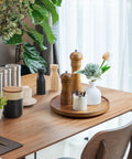 10 Inch Acacia Wood Lazy Susan Turntable Organizer For Cabinet Round Serving Tray Decorative Vintage Centerpiece Candle Holder Tray Your Go To Farmhouse Style Kitchen Countertop And Coffee Table Decor on a dining table with condiments.