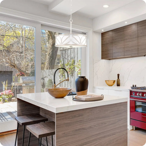 Eloise 16 Inch 3 Light Modern Pendant Light Chandelier in a bright kitchen with drum shade and antique white finish.