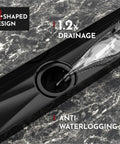 Close-up of 24 Inch Linear Shower Drain With Accessories showcasing X-shaped design and central outlet in dark finish.