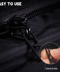 Close-up of Two Pack Heavy Duty Titanium Zipper Pull Replacements For Backpacks Luggage Jackets And Outdoor Gear Ultra Durable Easy To Install Universal Fit Black attached to a black zipper, emphasizing size and installation ease.