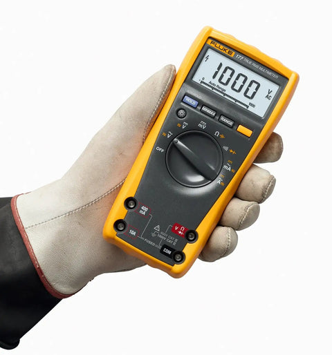 Person holding True-RMS Digital Multimeter Pro Grade Shop-Ready With 6000 Count Scale, Fast 4x Per Second Updates, 33-Segment Bar Graph