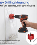 Installation of in wall cable management kit for TVs using a power drill and included hole saw for 2-3/8 inch grommet placement.