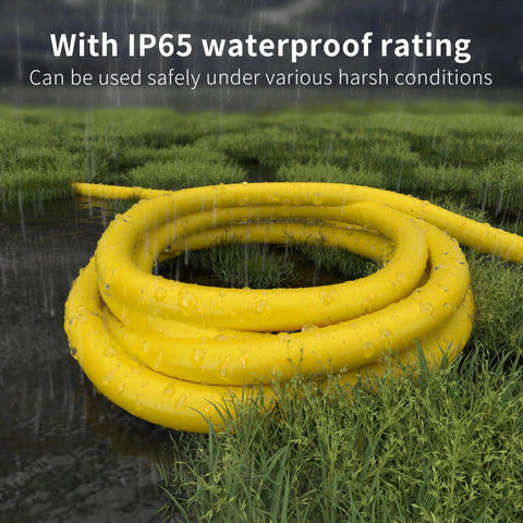 Tough As Nails Heavy Duty Outdoor Extension Cord 100 Ft Waterproof with Lighted End in wet grassy area showcasing waterproof feature