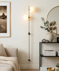 Equinox LED Wall Sconce Indoor Plug In Light For Bedroom And Bathroom With Glass Globe Shades Industrial Wall Mounted Fixture And On Off Switch Gold Finish Perfect For A Modern Home Vibe glowing in a modern living room