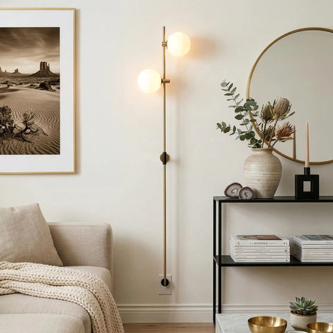 Equinox LED Wall Sconce Indoor Plug In Light For Bedroom And Bathroom With Glass Globe Shades Industrial Wall Mounted Fixture And On Off Switch Gold Finish Perfect For A Modern Home Vibe glowing in a modern living room