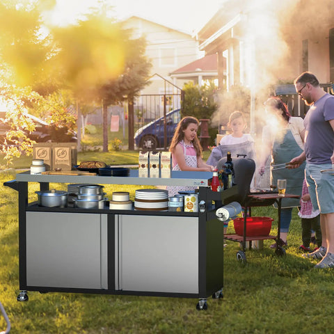 Rolling Outdoor Kitchen Island With Stainless Steel Table Top, BBQ Grill Cart, in a backyard setting with people grilling