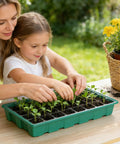 A woman and child planting seedlings in a Seed Starter Tray Kit With Humidity Domes And Base 5 Pack No Fuss Setup For 200 Cells.