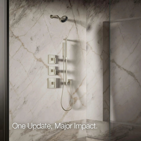 Statement VES Single-Function Showerhead 1.5 GPM Vibrant Brushed Nickel in marble shower with wall-mounted controls
