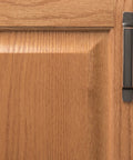 Solid Core Cabinet Pulls for Kitchen and Dresser Doors Richmond Collection Oil Rubbed Bronze Highlighted Bar Pulls With Three Inch Center To Center Four And Nine Sixteenths Inches Long Luxury Hardware For Contemporary And Traditional Includes Mounting shown on wood cabinet door.