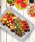 25 Pack Disposable Aluminum Grill Pans For Outdoor Cooking And Camping Large 16 By 12 Inch Aluminum Trays With Holes filled with grilled vegetables