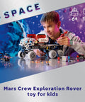Young boy assembling Technic Mars Crew Exploration Rover Dope Build Kit For Space Fans Ages 11 And Up with detailed parts.