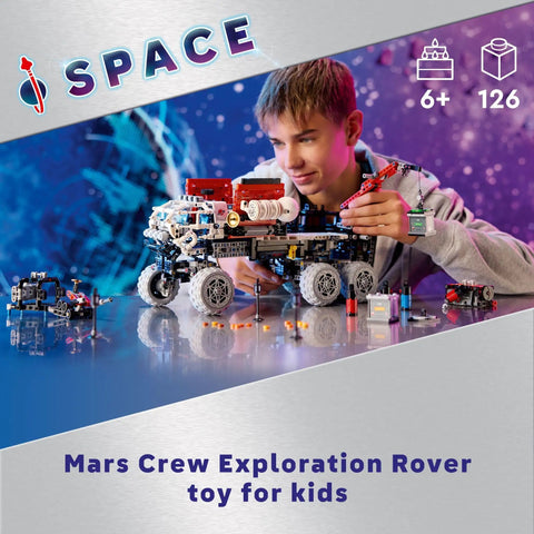 Young boy assembling Technic Mars Crew Exploration Rover Dope Build Kit For Space Fans Ages 11 And Up with detailed parts.