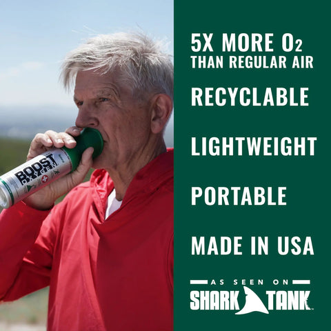 Man using Boost Oxygen Natural 5L Canister Six Pack for Respiratory Support Altitude against mountain background.
