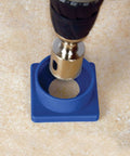 Top-down view of 1-3/8 in Xtreme Diamond Hole Saw with water delivery system in a blue plastic guide base