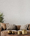 Premium Pink Off White And Cream Textured Wallpaper Rolls With Killer Mica Stone Chip Look applied in a cozy living room setting.