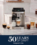 Straight Up Premium Automatic Espresso Machine With Integrated Milk Frother with coffees and milk on counter in kitchen.