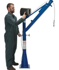 Operator using Powered Cable Winch on Built Tough AC Power Jib Crane With 1500 Lb Capacity And 66 Inch Telescoping Boom.