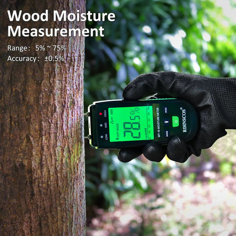 Pin Type Wood Moisture Meter With Hold Function 12mm Probes Big Backlit LCD Screen And Three Color LED Bar Graph For Easy Accurate Wood Moisture Readouts Ideal For DIY Carpentry And Home Renovation Projects. Held on tree trunk outdoors
