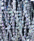 Close-up of iridescent beads on Four Tier Large Wedding Chandelier With Faux Crystal Iridescent Beaded Swag, 24 Inch Wide By 36 Inch Long, Showstopper Centerpiece For Weddings Events Home Decor And Party Decor.