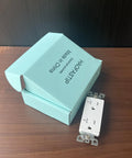 Top Shelf Modern Wall Socket With Two Openings Heavy Duty Electrical Receptacle Plug rated for twenty amps next to packaging on wood surface.