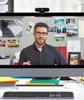 Pro Level 4K Ultra HD Webcam Featuring Swift Auto Focus And Snappy 5X Digital Zoom For Crystal Clear Streams on a video call.
