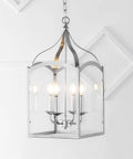 Silver 11 Inch Four Light Traditional Lantern Pendant With Metal Frame And Clear Glass Shade Classic Chandelier For Foyer Or Kitchen Island Energy Saving LED Bulbs Included hanging in a white room.