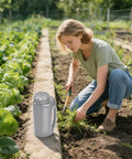 Person gardening with Adjustable Handheld Seed Shaker And Spreader For Fertilizer Grass Seed Ice Melt And Lawn Care Premium Durable Portable All Season Spreader In Gray next to her.