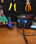 Upgraded 2 In 1 ESD Safe Soldering Desoldering Station setup on workbench with fast heating desoldering gun in use on circuit board