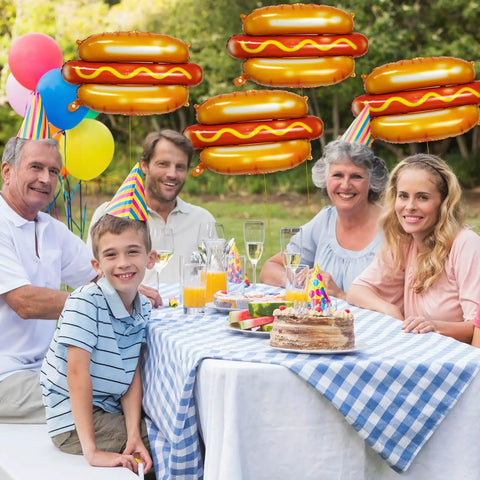 Adults and child at picnic with 7 Pack 28 Inch Hot Dog Balloons Foil Mylar Helium Balloons For BBQ Picnic Birthday Carnival Cookout Party