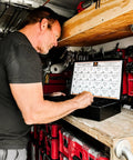 Professional Grade Heavy Duty Metal Drawer Organizer Containing 1275 Piece Metric 10.9 Coarse Thread Hex Bolts Nuts Flat Washers A Solid Job Site Workhorse in use by a worker.