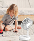 Child playing near 8 Inch Oscillating Desk Fan With Rechargeable Battery USB Powered Quiet Portable Cooling For Office And Home