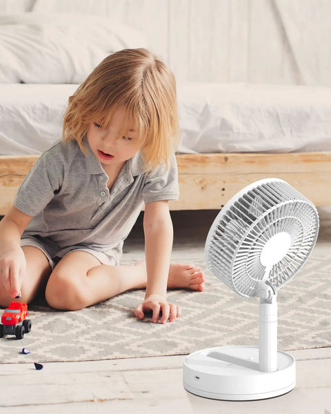 Child playing near 8 Inch Oscillating Desk Fan With Rechargeable Battery USB Powered Quiet Portable Cooling For Office And Home