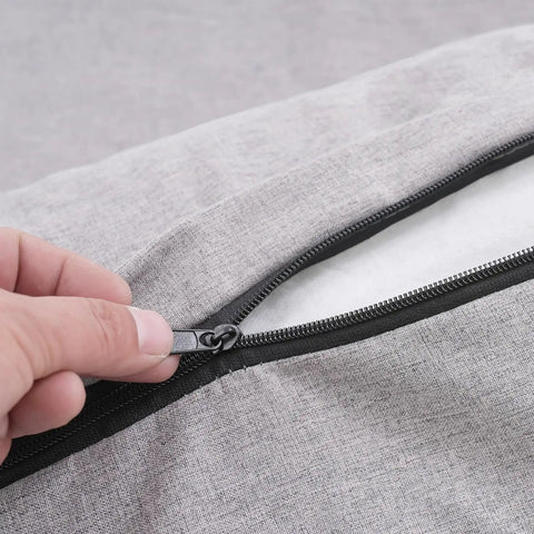 Close-up of the zipper on the gray fabric cover of the electric power lifting bed back rest.