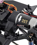 Close-up of the One Tenth Scale RC Crawler Chassis Kit With 313mm Wheelbase, 35T motor visible, nylon frame, DIY assembly.
