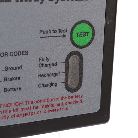 Close-up of 12V LED Trailer Breakaway Kit With Universal Brake Controls showing test LED, charge indicators, and instructions.